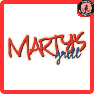 The image shows the logo of Marty's Grill- Mechanicsville $15 Gift Certificate*. The text "MARTY'S" is written in bold red letters with a blue shadow effect, and "grill" is written in smaller blue letters. There's a red border around the image and a circular emblem in the top right corner.