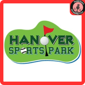 A logo for Hanover Sports Park $20 Gift Certificate. It features the park's name with a golf ball replacing the "O" in "HOVER" and a baseball replacing the "O" in "SPORTS". A red flag on a golf course is integrated into the background. A "Rooa Town Shopping Club" badge is in the corner.